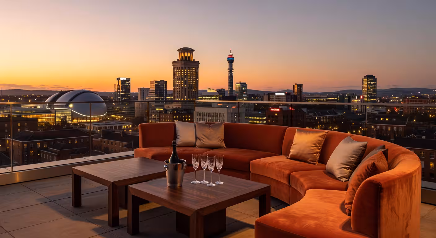 Exclusive Birmingham rooftop bar terrace at golden hour with city skyline views